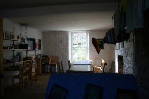 The dining room in the background with the common room in the foreground.