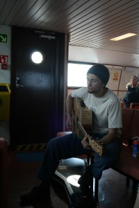 Adam singing his Ferry Song on a CalMac ferry.