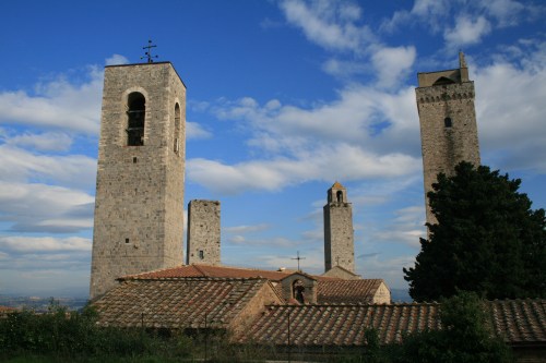 I think San Gimignano used to have 97 towers.  Only 13 are left.  A family with money to blow would build a tower.  Another family with money wanted to show off their wealth and built a taller tower.  You get the picture.